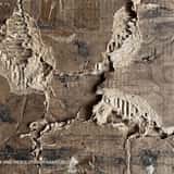 Highly distressed and crushed brown cardboard texture, featuring deep tears, peeling paper layers, and heavy structural damage.