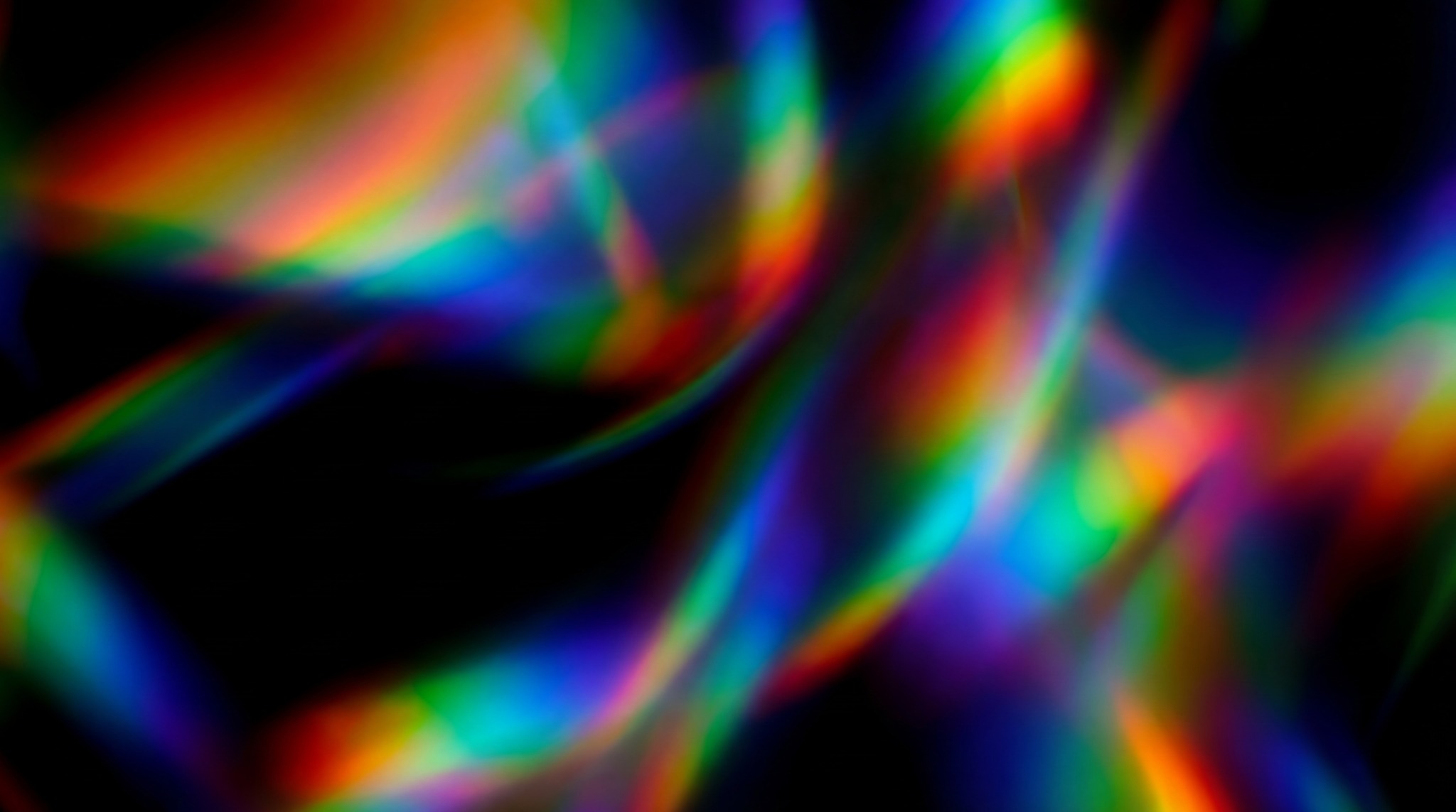 Abstract overlay with vibrant, shifting rainbow colors against a black background.