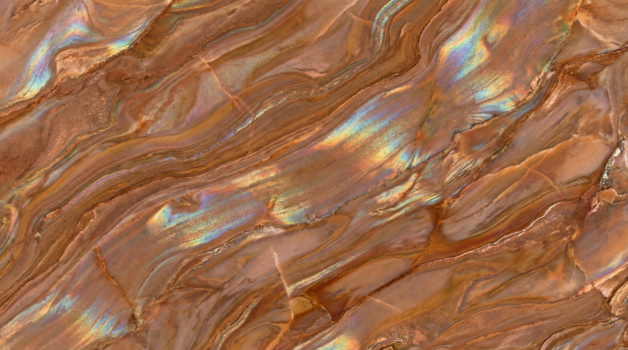 A close-up of a brown marble texture with swirling patterns and iridescent rainbow highlights.