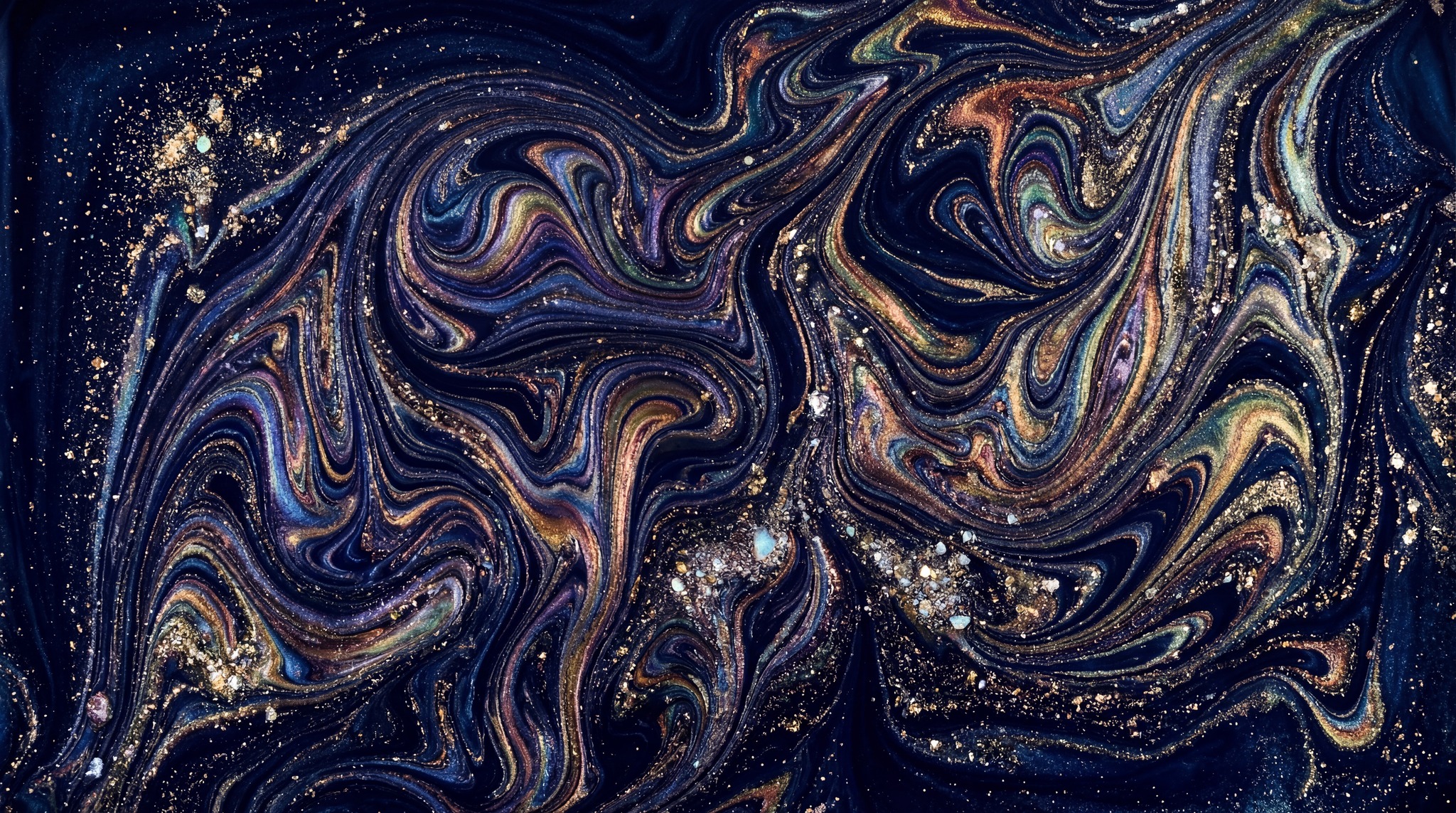 Abstract dark blue marble texture with swirling patterns of iridescent gold, purple, and teal, speckled with glitter.