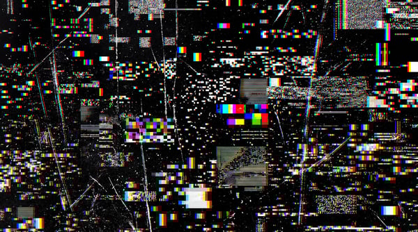 A 4K digital glitch texture featuring high-contrast pixelation, colorful block glitches, and fine static noise on a black background.