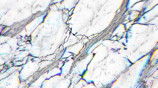 A white marble texture with cracked veins and a chromatic aberration effect creating cyan, magenta, and yellow digital glitch lines.