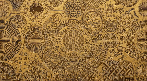 A detailed close-up of an ornate ancient gold texture featuring intricate carvings of dragons, lotus flowers, and geometric symbols like the 'shou' character and the flower of life.