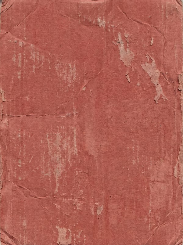 A 4K texture showing worn red cardboard with visible creases and peeling surface.